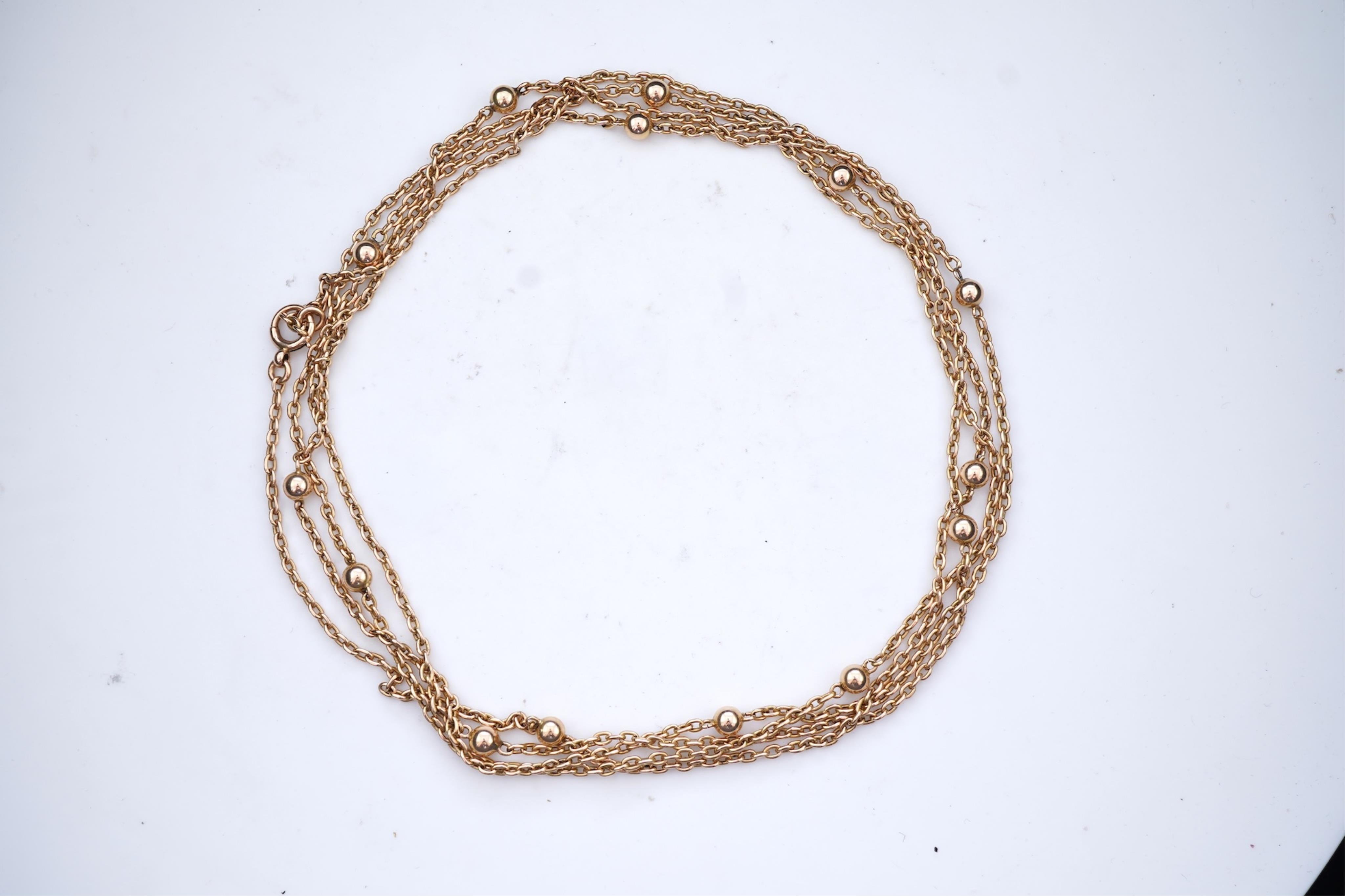 A gold long guard chain, early 20th century